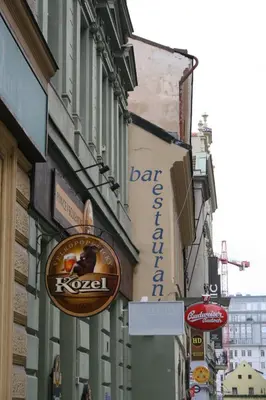 a sign for a bar on the side of a building at Apartment Sophia in Prague