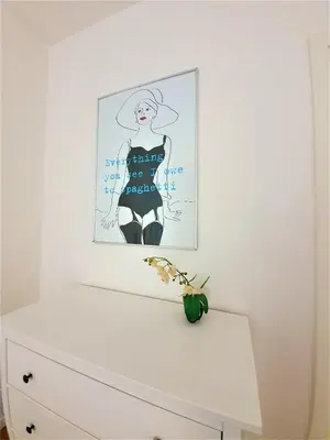 a drawing of a woman sitting on top of a dresser at Apartment Sophia in Prague