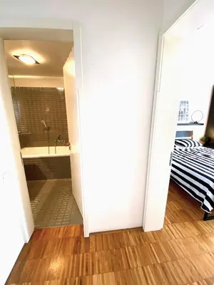 a bathroom with a tub and a sink at Spacious Apartment near City Center with Balcony and Garage Parking in Prague