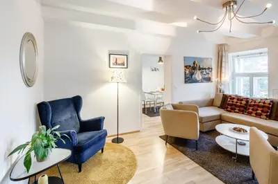 a living room with a couch and a chair at Residence Vinohrad in Prague
