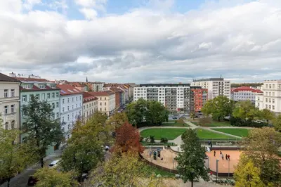 a view of a city with buildings and a park at Residence Vinohrad in Prague