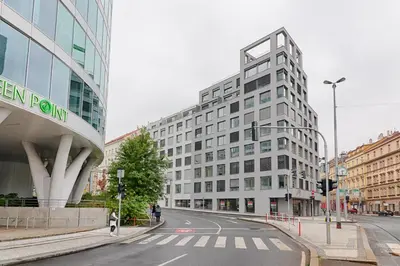 an empty city street with a tall white building at Studio Mozart, Free Onsite Parking, Air Conditioning, 1Gbs WiFi in Prague