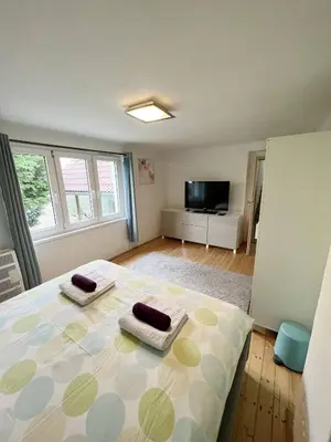 a bedroom with a bed with two towels on it at Family House in Spa Town Podebrady with Garden in Poděbrady