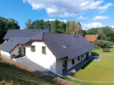 an overhead view of a house with a black roof at Apartmán Pod Hrází Chráštany in Benešov