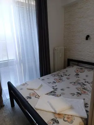 a bedroom with a bed with flowers on it at GeraStay Sokolska in Prague