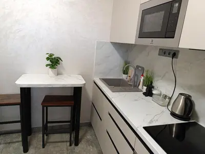 a kitchen with a sink and a counter top at GeraStay Sokolska in Prague