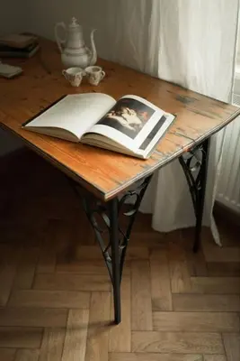 a table with an open book on top of it at Artisan & Old-timey 2 bedrooms home in Prague