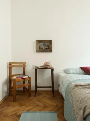a living room with a bed and a side table at Artisan & Old-timey 2 bedrooms home in Prague