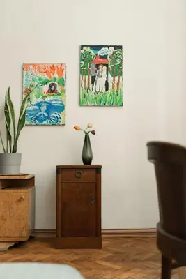 a room with a vase on a table with paintings at Artisan & Old-timey 2 bedrooms home in Prague