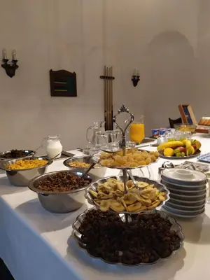 a table topped with plates of food on a table at Hotel Sanssouci in Prague