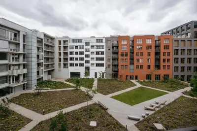 a view of a courtyard with apartment buildings at Prague Days - One-bedroom Apartment with Garage Parking and Balcony in Prague