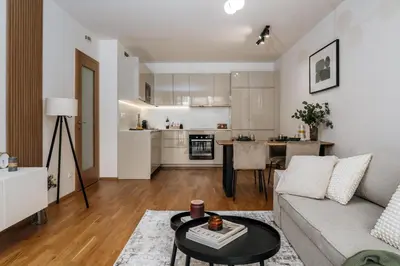 a living room with a couch and a table at Prague Days - One-bedroom Apartment with Garage Parking and Balcony in Prague