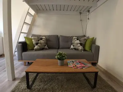 a living room with a couch and a coffee table at STYLISH FLAT IN PRAGUE - Vinohrady in Prague