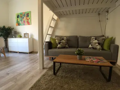 a living room with a couch and a table at STYLISH FLAT IN PRAGUE - Vinohrady in Prague