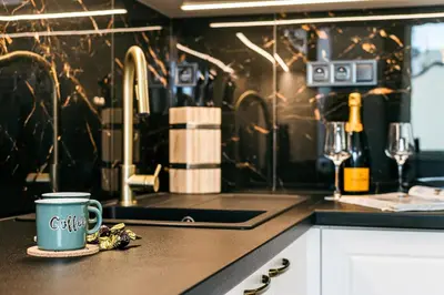 a coffee cup sitting on a counter in a kitchen at Apartment Linda Prague in Prague