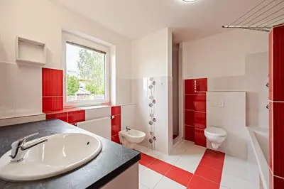 a bathroom with a sink and a toilet at U tří koček in Herink