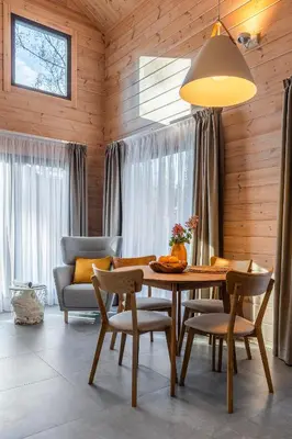 a dining room with a table and chairs at Finskä chata in Samopše