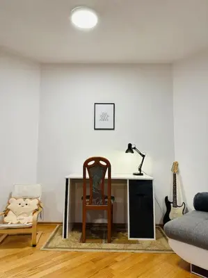 a living room with a desk and a chair at Family-Friendly Prague 5 Stay in Prague