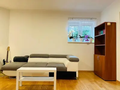 a living room with a couch and a window at Family-Friendly Prague 5 Stay in Prague