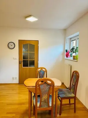 a dining room with a table and two chairs at Family-Friendly Prague 5 Stay in Prague
