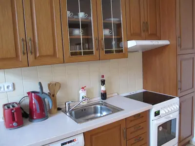 a kitchen with a sink and a stove top oven at Apartments near Lesser Town in Prague