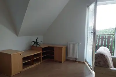 a room with a desk and a large window at Klasický dům, 5 ložnic , 5 bedrooms, Praha in Prague