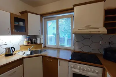 a kitchen with a sink and a stove and a window at Klasický dům, 5 ložnic , 5 bedrooms, Praha in Prague