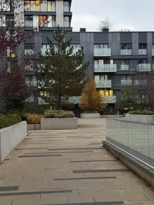 a parking lot in front of a tall building at Garden Towers Apartment in Prague Center in Prague