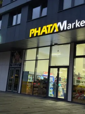 a store front of a pharia market with glass doors at Garden Towers Apartment in Prague Center in Prague
