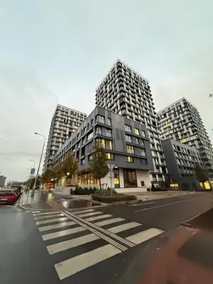 two tall buildings on a city street with a crosswalk at Garden Towers Apartment in Prague Center in Prague