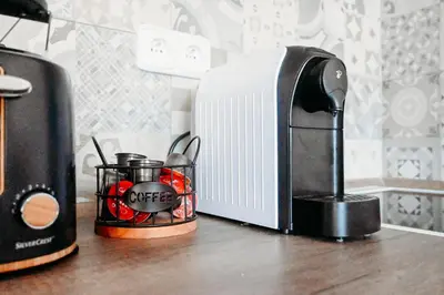 a coffeemaker and a coffee maker on a counter at Vítovský statek in Žižice