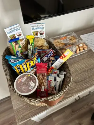 a basket of food and snacks on a table at Vítovský statek in Žižice