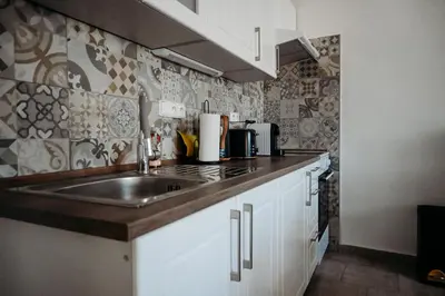 a kitchen with a sink and a counter top at Vítovský statek in Žižice