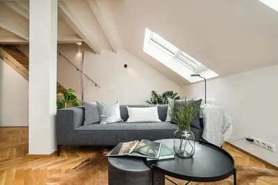 a living room with a couch and a table at Large and modern apartment in the heart of Prague in Prague