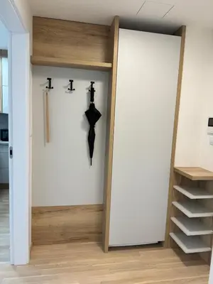 a room with a clock on the wall at Smíchov City apartment - Albrigtova in Prague