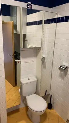 a bathroom with a white toilet in a stall at Apartment Českomoravská - O2 Arena Prague in Prague