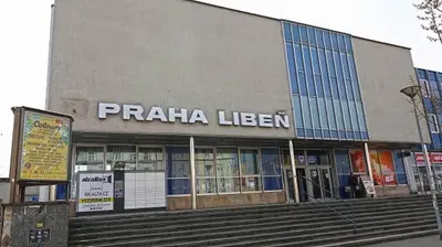 a building with a pizza library with steps in front at Apartment Českomoravská - O2 Arena Prague in Prague