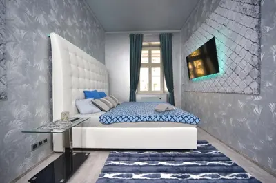a bedroom with a white bed and a window at TF Wellness in Prague