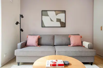 a living room with a couch and a table at Blueground Holešovice family-friendly nr park PRG-3 in Prague