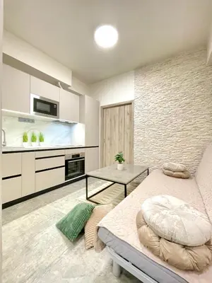 a living room with a bed and a table at Apartment in the center on Sokolska street in Prague