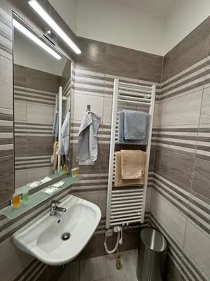 a bathroom with a sink and a mirror at Arbes 10 - At the yellow Duck in Prague