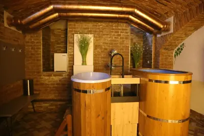 a bathroom with a sink and a brick wall at Arbes 10 - At the yellow Duck in Prague