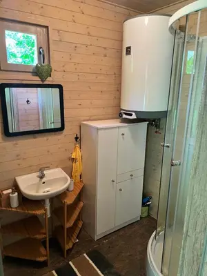 a bathroom with a sink and a shower at Biotop Kotlyk in Netvořice