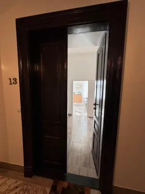 an open door with a mirror in a room at Arbes 13 - Sweet Home in Prague