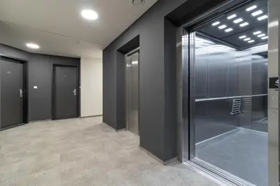 a hallway with glass doors in a building at SMART Studio with Ultra Fast 1Gbps WiFi and Air Conditioning in Prague