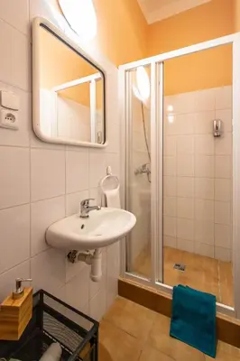 a bathroom with a sink and a shower at Sweet Home by Ruterra in Prague
