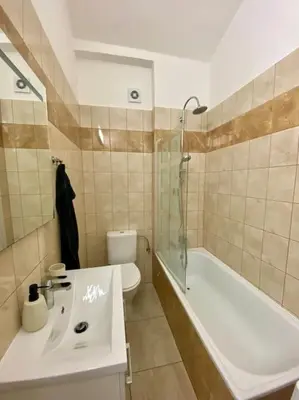 a bathroom with a sink and a bath tub at Cute botanical flat near by Žižkov tower in Prague