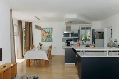a kitchen and dining room with a dining table at DiamondVilla, 4 bedroom Apartment, garden & spa in Prague