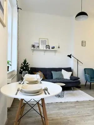 a living room with a table and a couch at Apartment by Charles Bridge in Prague