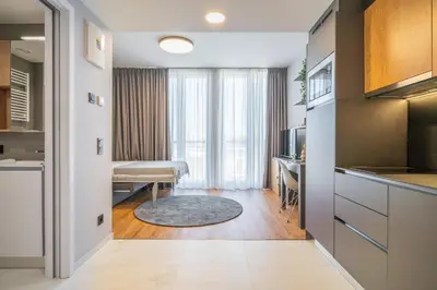 a bedroom with a bed and a flat screen tv at City Pop 2Night Prague - Self check-in in Prague
